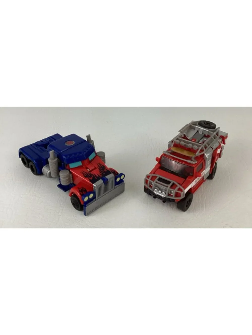 Transformers Dark Of The Moon Action Figures Ratchet Optimus Prime Autobot Toy